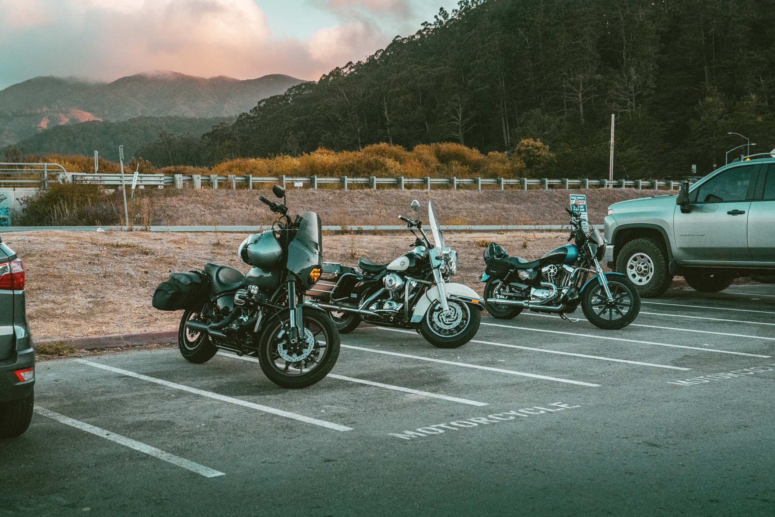 Motorcycle parking spots are located by the road.